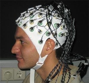 Someone wearing an EEG cap brain games
